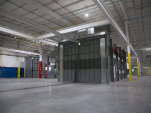 Industrial paint booth with bifold doors
