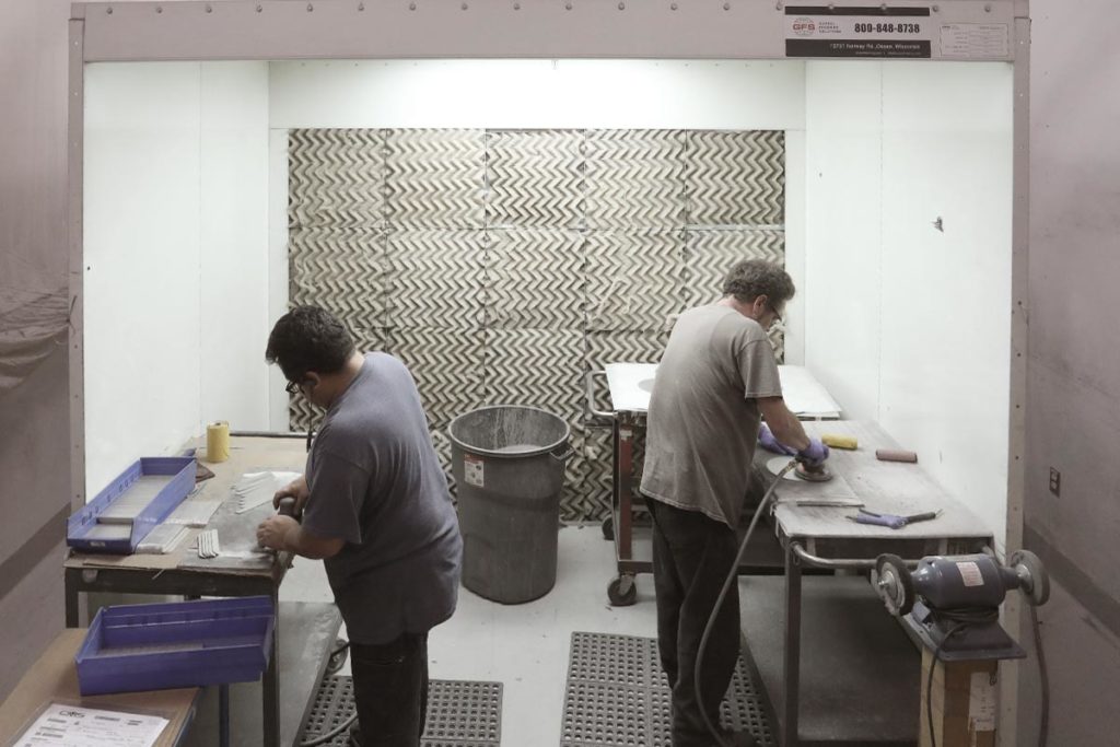 GFS Sanding Booth with 2 people sanding parts