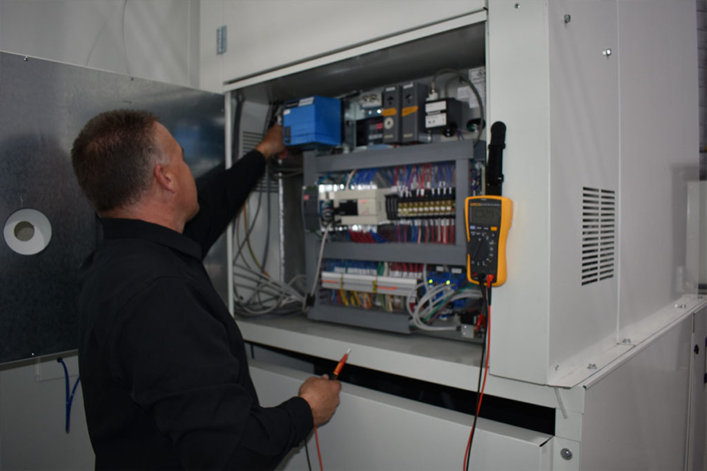 GFS - SPM technician servicing GFS Paint Booth Heat Unit