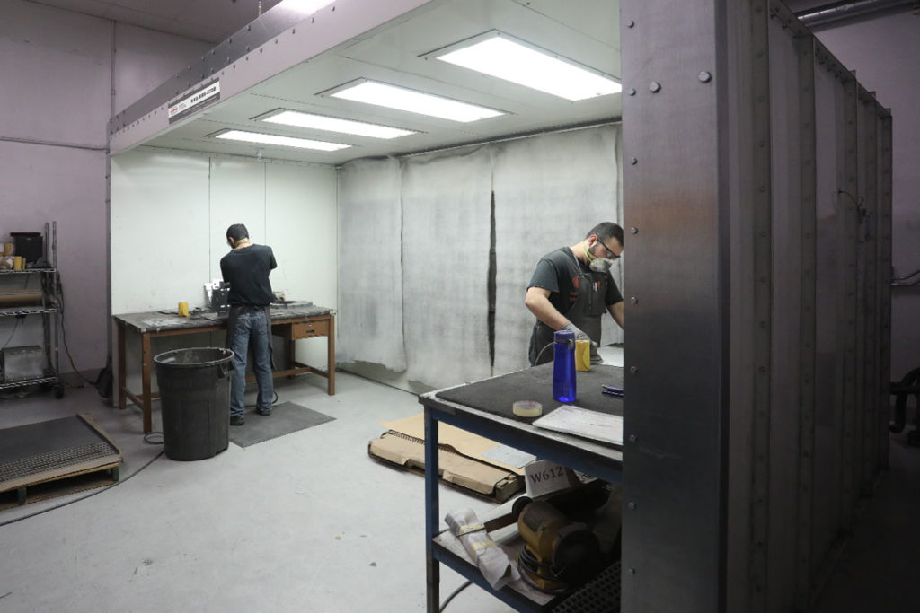 GFS Sanding-Grinding Booth with 2 people prepping parts