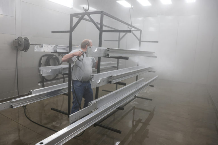 Washing parts in GFS Wash booth before powder coating in GFS Powder booth