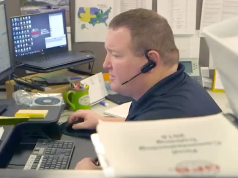 A GFS employee providing technical phone support